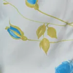 white floral fabric with blue flowers